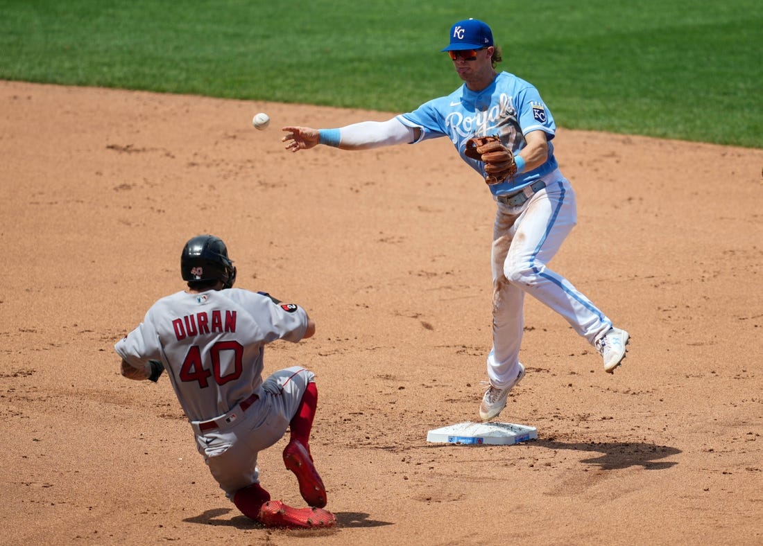 Aug 7, 2022; Kansas City, Missouri, USA; Kansas City Royals shortstop Bobby Witt Jr. (7) throws to first base after forcing out Boston Red Sox center fielder Jarren Duran (40) during the fifth inning at Kauffman Stadium. Mandatory Credit: Jay Biggerstaff-USA TODAY Sports