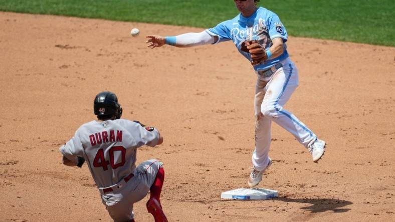 Aug 7, 2022; Kansas City, Missouri, USA; Kansas City Royals shortstop Bobby Witt Jr. (7) throws to first base after forcing out Boston Red Sox center fielder Jarren Duran (40) during the fifth inning at Kauffman Stadium. Mandatory Credit: Jay Biggerstaff-USA TODAY Sports