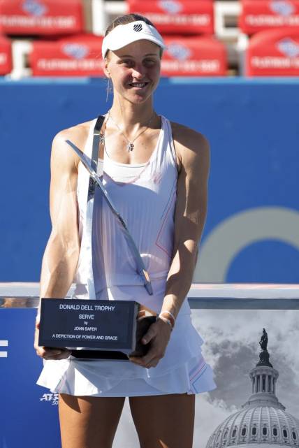 Aug 7, 2022; Washington, DC, USA; Liudmila Samsonova celebrates with the championship trophy after her match against Kaia Kanepi (EST) (not pictured) in the women's singles final on day seven of the Citi Open at Rock Creek Park Tennis Center. Mandatory Credit: Geoff Burke-USA TODAY Sports