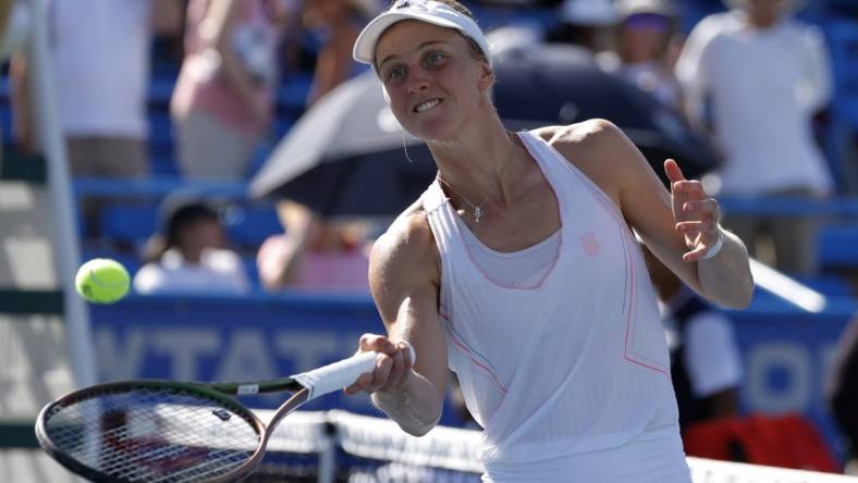 Aug 7, 2022; Washington, DC, USA; Liudmila Samsonova balls celebrates by hitting balls into the stands after her match against Kaia Kanepi (EST) (not pictured) in the women's singles final on day seven of the Citi Open at Rock Creek Park Tennis Center. Mandatory Credit: Geoff Burke-USA TODAY Sports