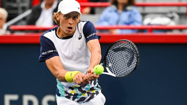 Aug 8, 2022; Montreal, Quebec, Canada; Emil Ruusuvuori (FIN) hits a shot against Stan Wawrinka (SUI) (not pictured)  during first round play at IGA Stadium. Mandatory Credit: David Kirouac-USA TODAY Sports