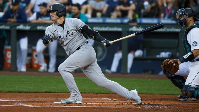 Aug 8, 2022; Seattle, Washington, USA; New York Yankees third baseman Josh Donaldson (28) hits a two-run single against the Seattle Mariners during the first inning at T-Mobile Park. Mandatory Credit: Joe Nicholson-USA TODAY Sports