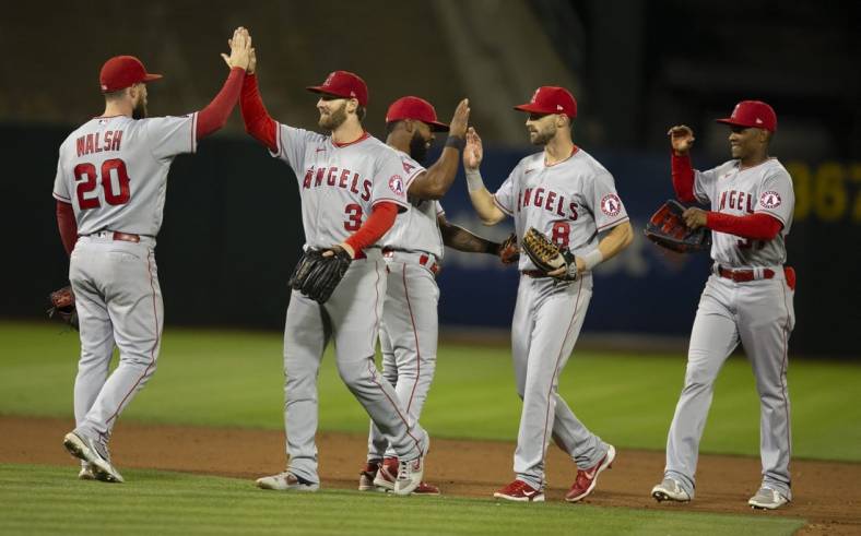 Aug 8, 2022; Oakland, California, USA; Los Angeles Angels players celebrate their 1-0 victory over the Oakland Athletics at RingCentral Coliseum. Mandatory Credit: D. Ross Cameron-USA TODAY Sports
