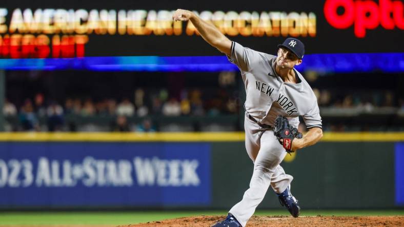 Aug 8, 2022; Seattle, Washington, USA; New York Yankees relief pitcher Clay Holmes (35) throws against the Seattle Mariners during the ninth inning at T-Mobile Park. Mandatory Credit: Joe Nicholson-USA TODAY Sports