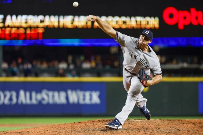 Clay Holmes of the New York Yankees pitches in the ninth inning