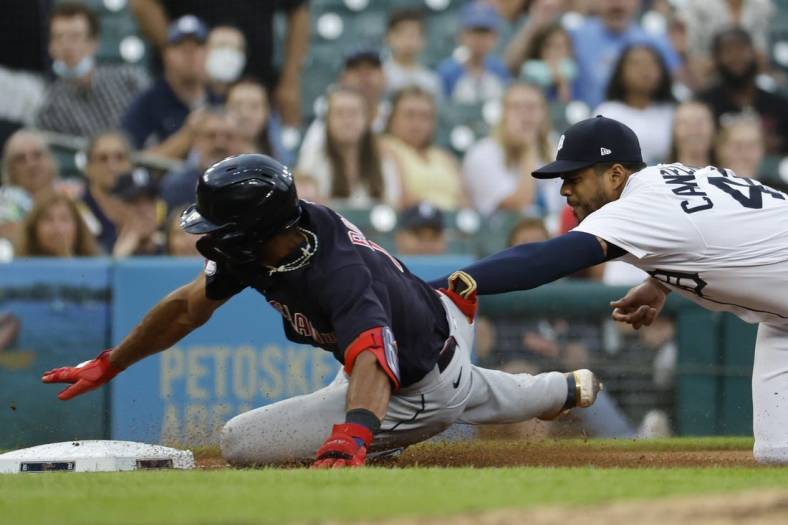 Aug 9, 2022; Detroit, Michigan, USA;  Cleveland Guardians shortstop Amed Rosario (1) is tagged out at third by Detroit Tigers third baseman Jeimer Candelario (46) in the fourth inning at Comerica Park. Mandatory Credit: Rick Osentoski-USA TODAY Sports