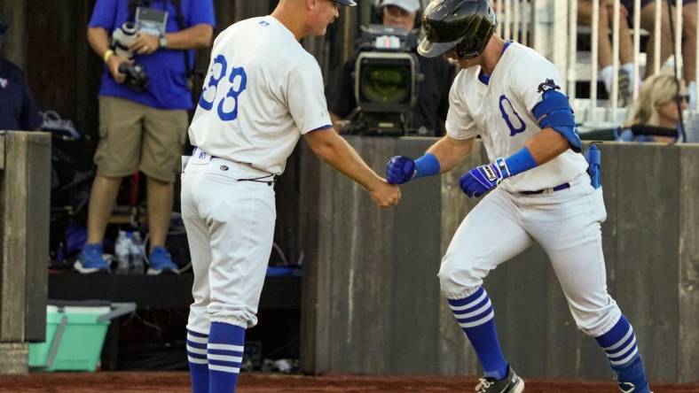 Peyton Wilson of the Quad Cities River Bandits celebrates a home run during a minor league game against Cedar Rapids at the Field of Dreams in Dyersville, Tuesday, Aug. 9, 2022.

Dsc00651 Jpg