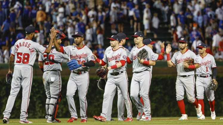 Aug 9, 2022; Chicago, Illinois, USA; Washington Nationals players celebrate after defeating the Chicago Cubs at Wrigley Field. Mandatory Credit: Kamil Krzaczynski-USA TODAY Sports