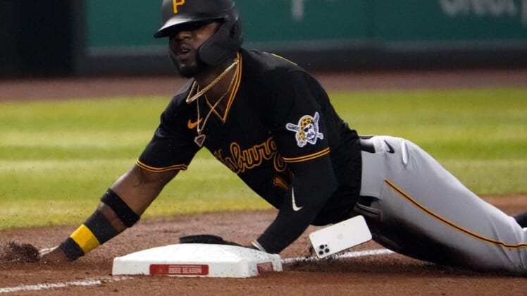 Aug 9, 2022; Phoenix, Arizona, USA; Pittsburgh Pirates second baseman Rodolfo Castro (14) loses his iPhone mobile cell phone as he slides into third base against the Arizona Diamondbacks during the fourth inning at Chase Field. Mandatory Credit: Joe Camporeale-USA TODAY Sports