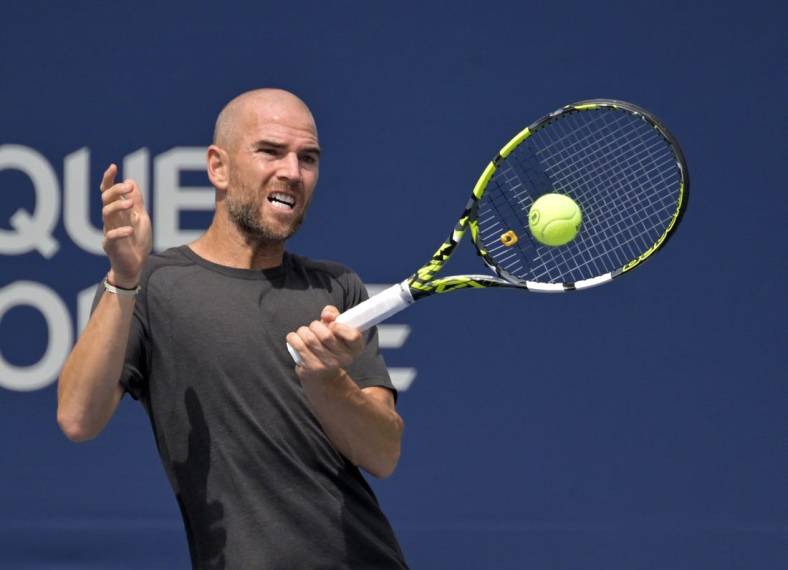 Aug 10, 2022; Montreal, QC, Canada; Adrian Mannarino (FRA) hits a forehand against Jannik Sinner (ITA) (not pictured) in second round play at IGA Stadium. Mandatory Credit: Eric Bolte-USA TODAY Sports