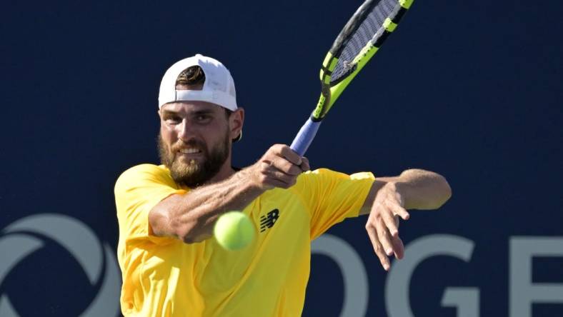 Aug 10, 2022; Montreal, QC, Canada; Maxime Cressy (USA) hits a forehand against Gael Monfils (FRA) (not pictured) in second round play at IGA Stadium. Mandatory Credit: Eric Bolte-USA TODAY Sports