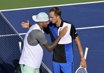 Aug 10, 2022; Montreal, QC, Canada; Nick Kyrgios (AUS) (left) and Daniil Medvedev hug in second round play at IGA Stadium. Mandatory Credit: Eric Bolte-USA TODAY Sports