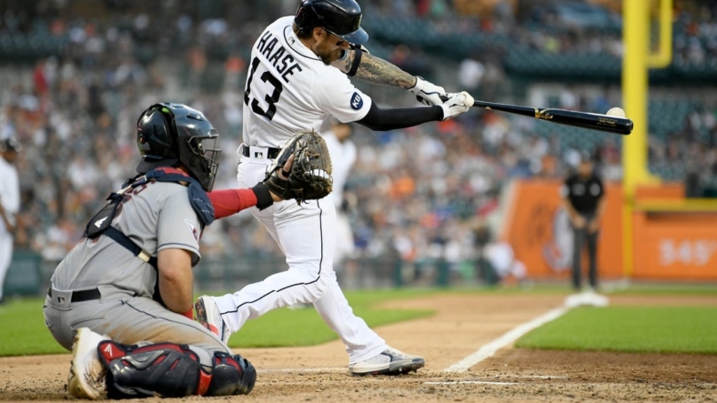 Aug 10, 2022; Detroit, Michigan, USA; Detroit Tigers catcher Eric Haase (13) hits an RBI double off Cleveland Guardians starting pitcher Aaron Civale (not pictured) in the fourth inning at Comerica Park. Mandatory Credit: Lon Horwedel-USA TODAY Sports