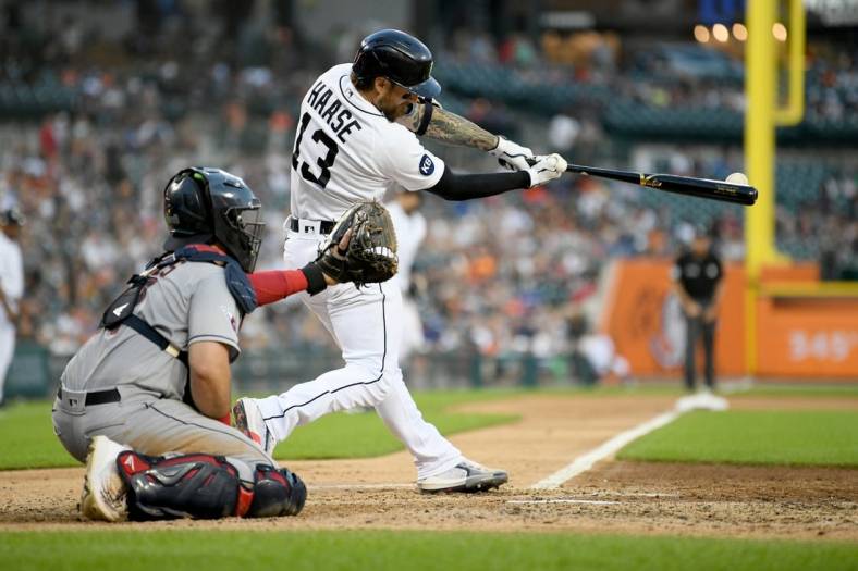 Aug 10, 2022; Detroit, Michigan, USA; Detroit Tigers catcher Eric Haase (13) hits an RBI double off Cleveland Guardians starting pitcher Aaron Civale (not pictured) in the fourth inning at Comerica Park. Mandatory Credit: Lon Horwedel-USA TODAY Sports