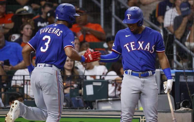 Aug 10, 2022; Houston, Texas, USA; Texas Rangers center fielder Leody Taveras (3) celebrates with third baseman Ezequiel Duran (70) after scoring a run during the fourth inning against the Houston Astros at Minute Maid Park. Mandatory Credit: Troy Taormina-USA TODAY Sports