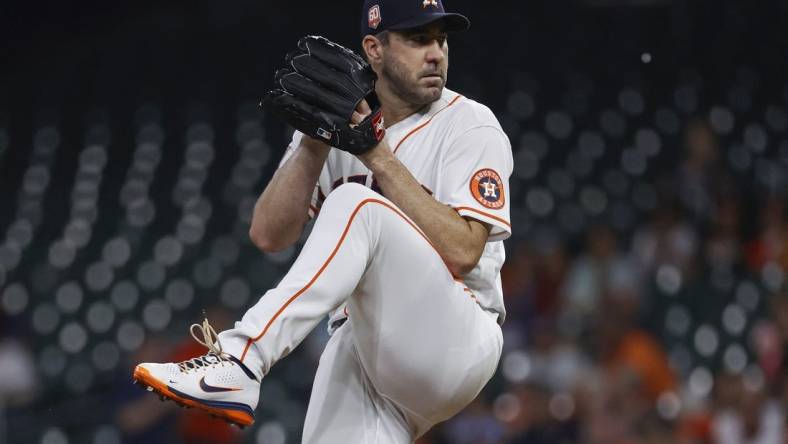 Aug 10, 2022; Houston, Texas, USA; Houston Astros starting pitcher Justin Verlander (35) delivers a pitch during the first inning against the Texas Rangers at Minute Maid Park. Mandatory Credit: Troy Taormina-USA TODAY Sports