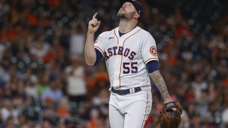 Aug 10, 2022; Houston, Texas, USA; Houston Astros relief pitcher Ryan Pressly (55) reacts after getting a strikeout during the ninth inning against the Texas Rangers at Minute Maid Park. Mandatory Credit: Troy Taormina-USA TODAY Sports