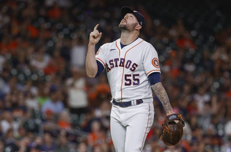 Aug 10, 2022; Houston, Texas, USA; Houston Astros relief pitcher Ryan Pressly (55) reacts after getting a strikeout during the ninth inning against the Texas Rangers at Minute Maid Park. Mandatory Credit: Troy Taormina-USA TODAY Sports