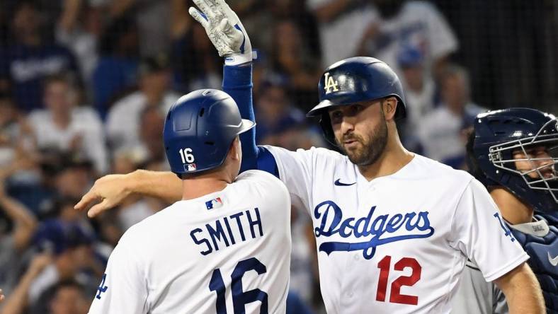 Aug 10, 2022; Los Angeles, California, USA; Los Angeles Dodgers right fielder Joey Gallo (12) celebrates with catcher Will Smith (16) after hitting a three run home run in the seventh inning against the Minnesota Twins at Dodger Stadium. Mandatory Credit: Richard Mackson-USA TODAY Sports