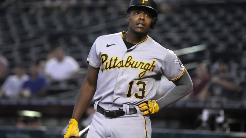 Aug 11, 2022; Phoenix, Arizona, USA; Pittsburgh Pirates third baseman Ke'Bryan Hayes (13) reacts after striking out against the Arizona Diamondbacks in the first inning at Chase Field. Mandatory Credit: Rick Scuteri-USA TODAY Sports