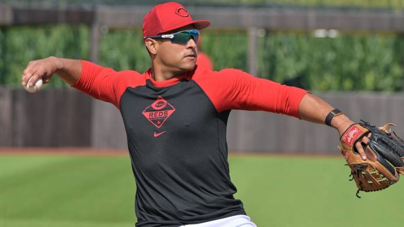 Aug 11, 2022; Dyersville, Iowa, USA; Cincinnati Reds designated hitter Donovan Solano (7) warms up before the game against the Chicago Cubs at Field of Dreams. Mandatory Credit: Jeffrey Becker-USA TODAY Sports