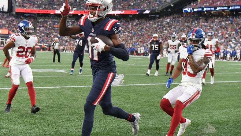 Aug 11, 2022; Foxborough, Massachusetts, USA; New England Patriots wide receiver Tyquan Thornton (11) catches a touchdown against the New York Giants during the first half of a preseason game at Gillette Stadium. Mandatory Credit: Eric Canha-USA TODAY Sports