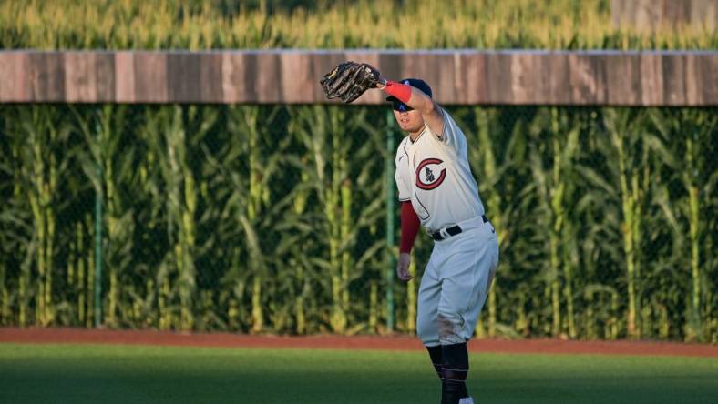 Aug 11, 2022; Dyersville, Iowa, USA; Chicago Cubs right fielder Seiya Suzuki (27) shields his eyes against the Cincinnati Reds during the third inning at Field of Dreams. Mandatory Credit: Jeffrey Becker-USA TODAY Sports