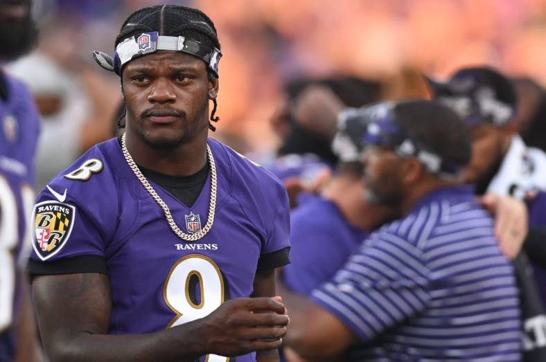 Aug 11, 2022; Baltimore, Maryland, USA;  Baltimore Ravens quarterback Lamar Jackson (8) walks on the sidelines during the first half Tennessee Titans at M&T Bank Stadium. Mandatory Credit: Tommy Gilligan-USA TODAY Sports