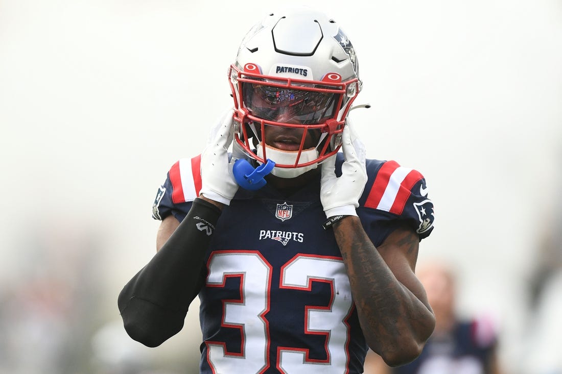 Aug 11, 2022; Foxborough, Massachusetts, USA; New England Patriots cornerback Joejuan Williams (33) walks onto the field before a preseason game against the New York Giants at Gillette Stadium. Mandatory Credit: Brian Fluharty-USA TODAY Sports