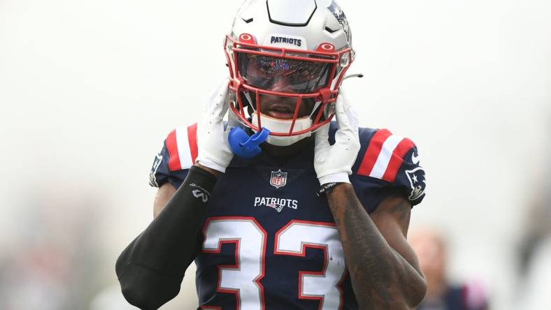 Aug 11, 2022; Foxborough, Massachusetts, USA; New England Patriots cornerback Joejuan Williams (33) walks onto the field before a preseason game against the New York Giants at Gillette Stadium. Mandatory Credit: Brian Fluharty-USA TODAY Sports