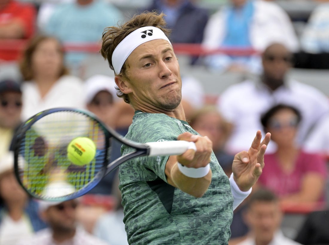 Aug 12, 2022; Montreal, QC, Canada; Casper Ruud (NOR) hits a forehand against Felix Auger-Aliassime (CAN) (not pictured) in quarterfinal play in the National Bank Open at IGA Stadium. Mandatory Credit: Eric Bolte-USA TODAY Sports