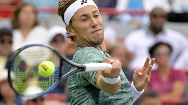 Aug 12, 2022; Montreal, QC, Canada; Casper Ruud (NOR) hits a forehand against Felix Auger-Aliassime (CAN) (not pictured) in quarterfinal play in the National Bank Open at IGA Stadium. Mandatory Credit: Eric Bolte-USA TODAY Sports