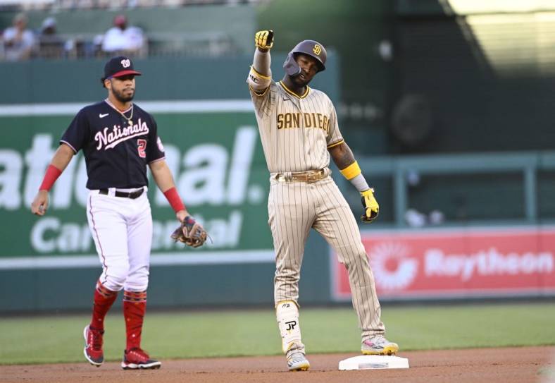Aug 12, 2022; Washington, District of Columbia, USA; San Diego Padres left fielder Jurickson Profar (10) reacts after hitting a double against the Washington Nationals during the first inning at Nationals Park. Mandatory Credit: Brad Mills-USA TODAY Sports