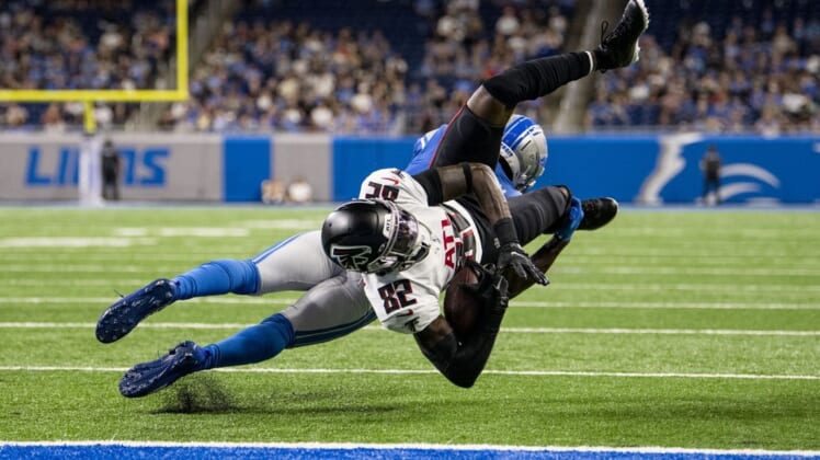 Aug 12, 2022; Detroit, Michigan, USA; Atlanta Falcons wide receiver Geronimo Allison (82) is upended by Detroit Lions safety Kerby Joseph (31) at the one yard line after catching a pass from quarterback Desmond Ridder (not pictured) in the second quarter at Ford Field. Mandatory Credit: Lon Horwedel-USA TODAY Sports