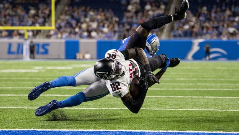 Aug 12, 2022; Detroit, Michigan, USA; Atlanta Falcons wide receiver Geronimo Allison (82) is upended by Detroit Lions safety Kerby Joseph (31) at the one yard line after catching a pass from quarterback Desmond Ridder (not pictured) in the second quarter at Ford Field. Mandatory Credit: Lon Horwedel-USA TODAY Sports