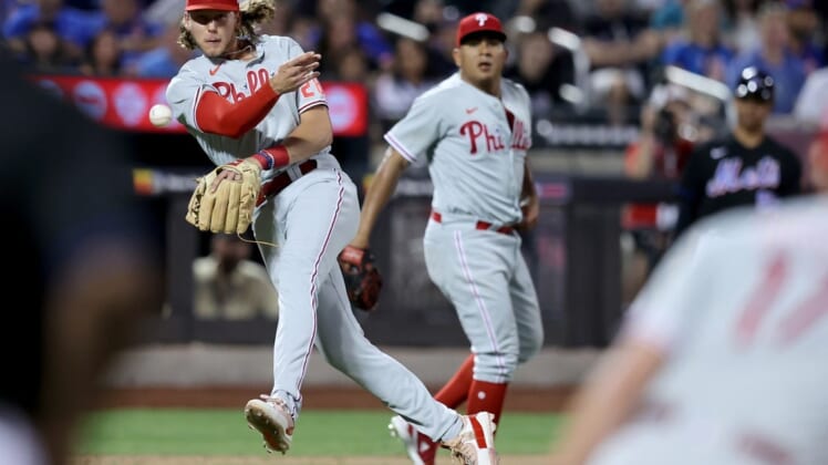 Aug 12, 2022; New York City, New York, USA; Philadelphia Phillies third baseman Alec Bohm (28) throws to first after fielding a ground ball by New York Mets right fielder Starling Marte (not pictured) with his bare hand during the sixth inning at Citi Field. Mandatory Credit: Brad Penner-USA TODAY Sports