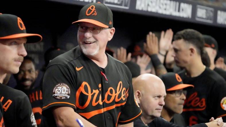 Aug 12, 2022; St. Petersburg, Florida, USA; Baltimore Orioles manager Brandon Hyde (18) reacts after his team scored in the sixth inning against the Tampa Bay Rays  at Tropicana Field. Mandatory Credit: Dave Nelson-USA TODAY Sports