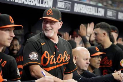Aug 12, 2022; St. Petersburg, Florida, USA; Baltimore Orioles manager Brandon Hyde (18) reacts after his team scored in the sixth inning against the Tampa Bay Rays  at Tropicana Field. Mandatory Credit: Dave Nelson-USA TODAY Sports