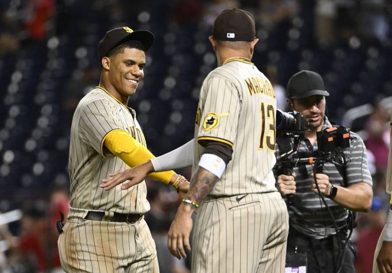 Aug 12, 2022; Washington, District of Columbia, USA; San Diego Padres right fielder Juan Soto (22) celebrates with third baseman Manny Machado (13) after the game against the Washington Nationals at Nationals Park. Mandatory Credit: Brad Mills-USA TODAY Sports