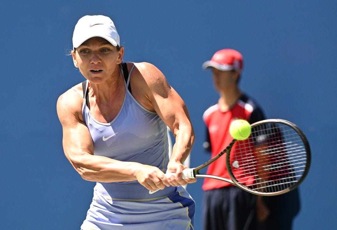 Aug 13, 2022; Toronto, ON, Canada;  Simona Halep (ROU)   plays a shot against Jessica Pegula (USA) (not pictured) at Sobeys Stadium. Mandatory Credit: Dan Hamilton-USA TODAY Sports