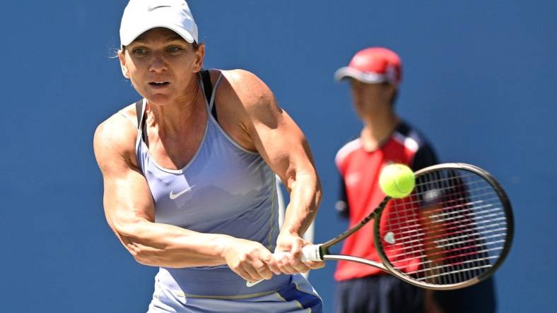 Aug 13, 2022; Toronto, ON, Canada;  Simona Halep (ROU)   plays a shot against Jessica Pegula (USA) (not pictured) at Sobeys Stadium. Mandatory Credit: Dan Hamilton-USA TODAY Sports