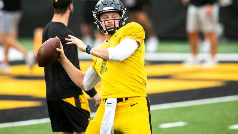 Iowa quarterback Spencer Petras (7) runs a drill during the Kids Day at Kinnick NCAA football practice, Saturday, Aug. 13, 2022, at Kinnick Stadium in Iowa City, Iowa.

220813 Ia Kids Day Fb 023 Jpg