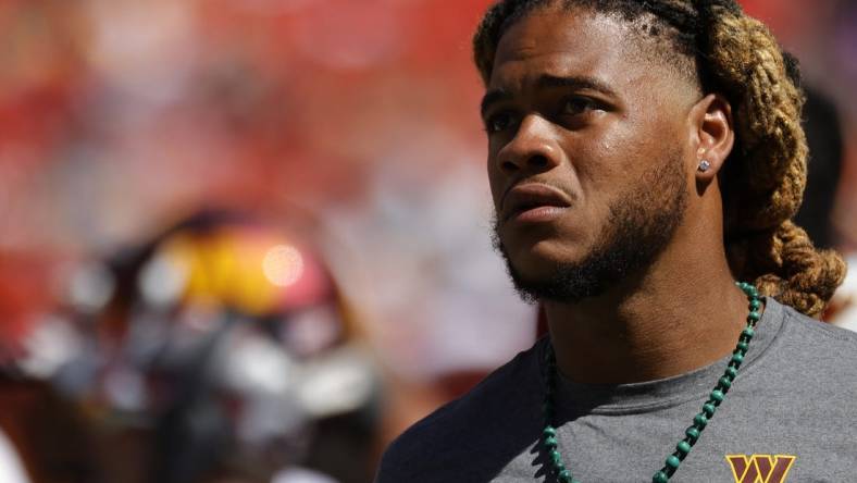 Aug 13, 2022; Landover, Maryland, USA; Injured Washington Commanders defensive end Chase Young looks on from the bench against the Carolina Panthers during the fourth quarter at FedExField. Mandatory Credit: Geoff Burke-USA TODAY Sports