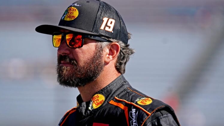 Aug 13, 2022; Richmond, Virginia, USA; NASCAR Cup Series driver Martin Truex Jr. (19) during practice and qualifying for the Federated Auto Parts 400 at Richmond International Raceway. Mandatory Credit: Peter Casey-USA TODAY Sports