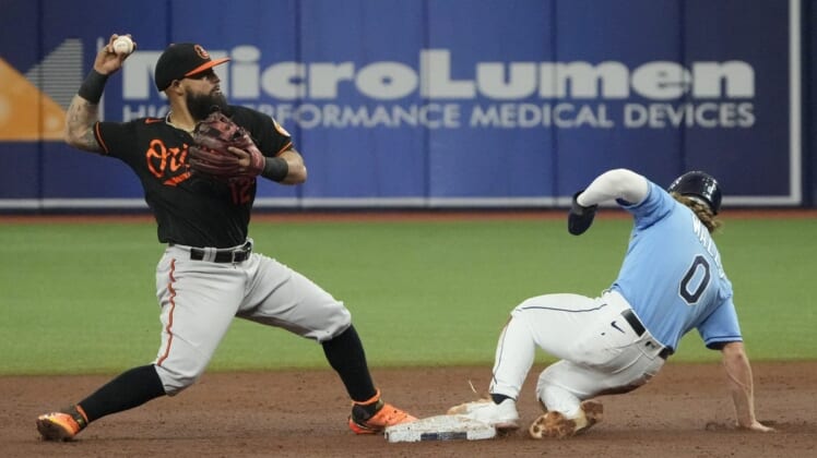 Aug 13, 2022; St. Petersburg, Florida, USA; Baltimore Orioles second baseman Rougned Odor (12) makes the force out at second on Tampa Bay Rays shortstop Taylor Walls (0) in the third inning at Tropicana Field. Mandatory Credit: Dave Nelson-USA TODAY Sports