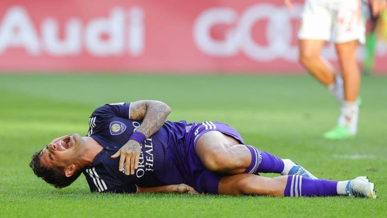 Aug 13, 2022; Harrison, New Jersey, USA; Orlando City SC forward Alexandre Pato (7) reacts after suffering an apparent injury against the New York Red Bulls during the first half at Red Bull Arena. Mandatory Credit: Vincent Carchietta-USA TODAY Sports