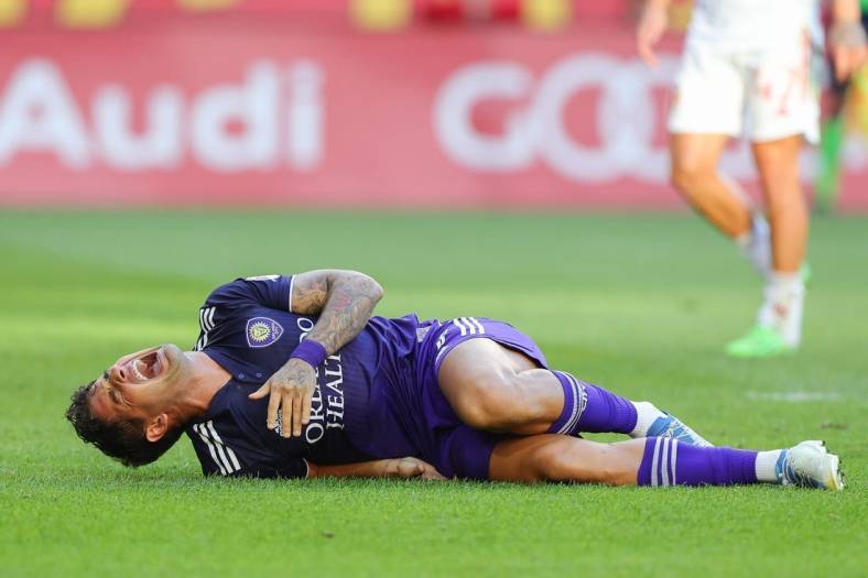 Aug 13, 2022; Harrison, New Jersey, USA; Orlando City SC forward Alexandre Pato (7) reacts after suffering an apparent injury against the New York Red Bulls during the first half at Red Bull Arena. Mandatory Credit: Vincent Carchietta-USA TODAY Sports