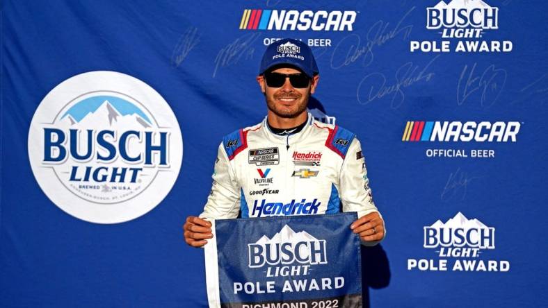 Aug 13, 2022; Richmond, Virginia, USA; NASCAR Cup Series driver Kyle Larson (5) celebrates winning the pole during practice and qualifying for the Federated Auto Parts 400 at Richmond International Raceway. Mandatory Credit: Peter Casey-USA TODAY Sports