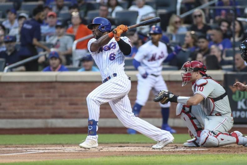 Aug 13, 2022; New York City, New York, USA;  New York Mets right fielder Starling Marte (6) hits a single in the first inning against the Philadelphia Phillies at Citi Field. Mandatory Credit: Wendell Cruz-USA TODAY Sports