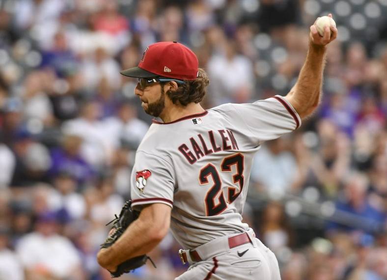Aug 13, 2022; Denver, Colorado, USA; Arizona Diamondbacks starting pitcher Zac Gallen (23) delivers a pitch in the first inning against the Colorado Rockies at Coors Field. Mandatory Credit: John Leyba-USA TODAY Sports